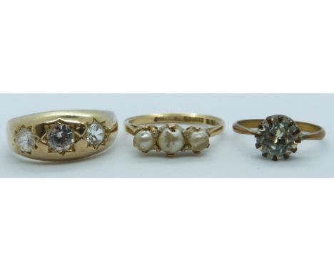 A 9ct gold ring (3g), a silver gilt ring set with paste and another ring