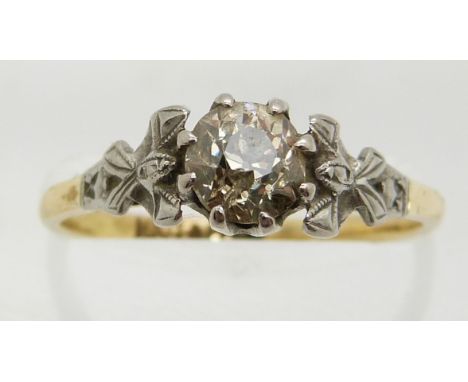 An 18ct gold ring set with a diamond of approximately 0.71ct in a platinum setting, 2.6g, size O