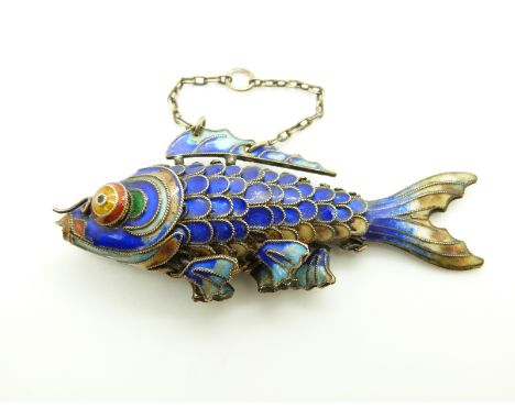 A silver fish pendant set with enamel, 7 x 3cm