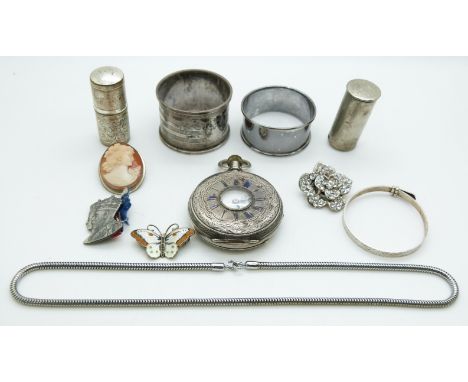 A collection of items including two silver napkin rings, cameo brooch, silver butterfly brooch set with enamel, silver pocket