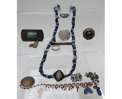 A collection of jewellery including beads, glass necklace, brooches including Victorian, Miracle, silver, enamel and Irish si
