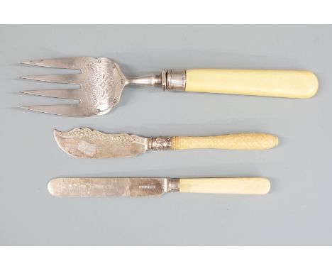 Two hallmarked silver bladed knives and a hallmarked silver tined fish serving fork, Sheffield 1882, length 25cm, weight of a