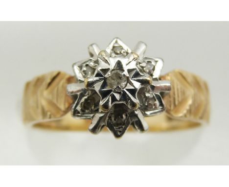 A 9ct gold ring set with diamonds in a cluster, 2.6g, size M