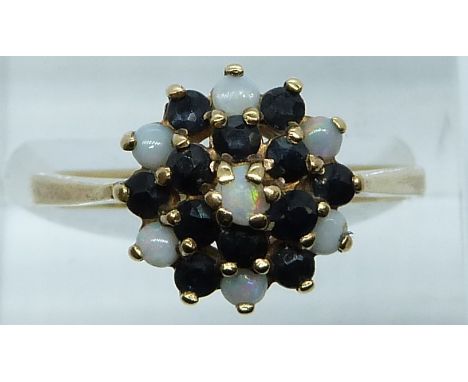 A 9ct gold ring set with sapphires and opals in the cluster, 2.9g, size O/P