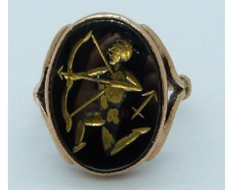 A 9ct gold ring set with a carved hematite cabochon, 5.9g, size I&nbsp;