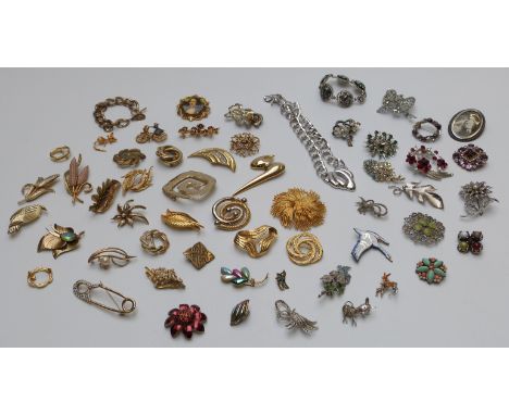 A large collection of vintage brooches including Monet, Hollywood, Sphinx, marcasite and paste, a Napier necklace and Sarah C