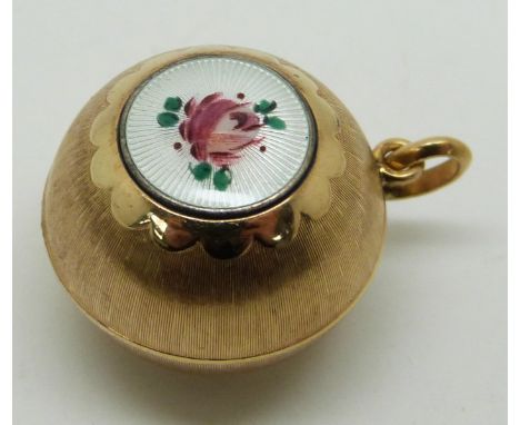A yellow metal spherical pendant with a guilloché enamel cartouche decorated with a rose, diameter 2.5cm, 6.3g&nbsp;