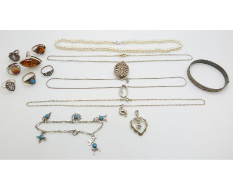 A pearl necklace, silver bangle, silver rings, silver locket etc