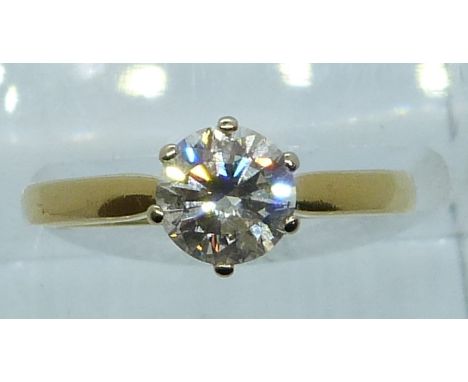 An 18ct gold ring set with a round brilliant cut diamond of approximately 1ct, 3.3g, size M