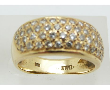 An 18ct gold ring set with four rows of diamonds, 5.6g, size L