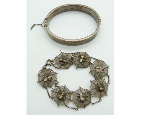 A silver bangle and filigree bracelet&nbsp;