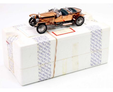 A Franklin Mint 1/24th scale 1921 Rolls Royce Silver Ghost fitted with a copper covered body, the model appears to be complet