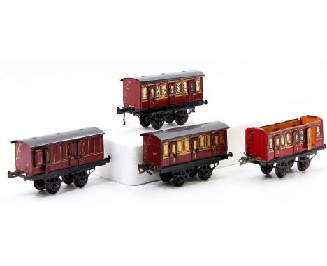 Three 1920’s No.1 LMS passenger coaches and one passenger guard’s van. Red lined gold. Long thin crimped bases. All door hand