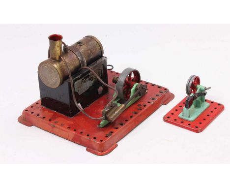 A collection of Mamod stationary steam components comprising of stationary steam plant with horizontal boiler powering a sing