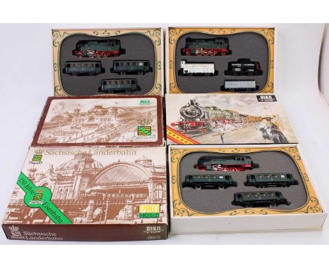 A collection of Piko H0 gauge Old Timer boxed trainsets to include 150 Years K Sachs EM16 locomotive and Three Coach gift set