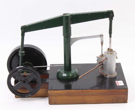 A scratch-built stationary beam engine, comprising of a single vertical cylinder engine, fitted with drain cocks and take-off