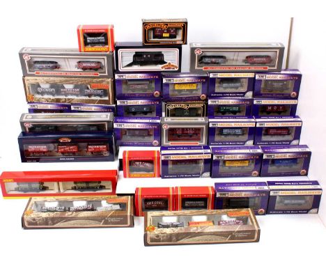 33 various boxed single issue and twin pack 00 gauge wagons and rolling stock by Bachmann, Mainline, Dapol and others, mixed 