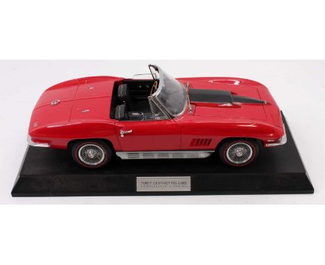 A Franklin Mint Connoisseur Series 1/12th scale 1967 Corvette L88 with its wooden stand, the model has been on display and is