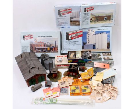 Large box containing mainly American outline buildings and accessories – including an engine shed. Many packets of spare part