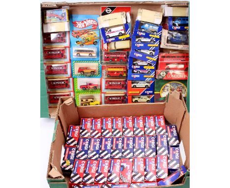 Two trays containing a collection of mixed scale Corgi, Hotwheels and similar carded and boxed diecast to include a Corgi XJ4
