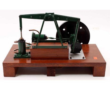 Scratchbuilt stationary beam engine, of usual specification, hand painted in green and raised on a wooden base to measure 20c