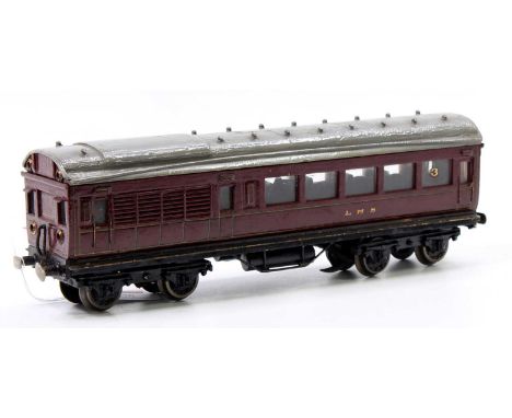 A wooden 0 gauge model of a LMS driving motor coach powered by a large heavy electric motor driving two axles on one bogie, v