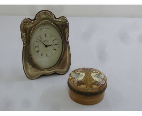 A silver mounted desk clock and a Tupton ware ceramic box and cover