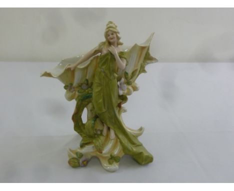 A continental Art Nouveau style porcelain figurine of a nymph, A/F