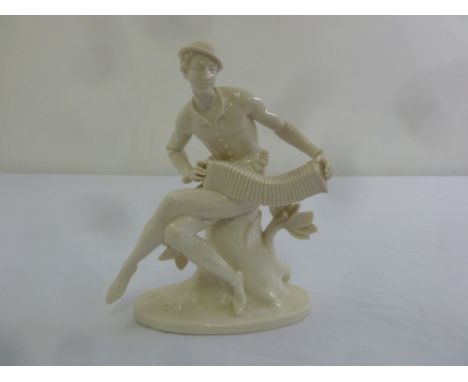 Blanc de Chine figurine of a man playing a musical instrument