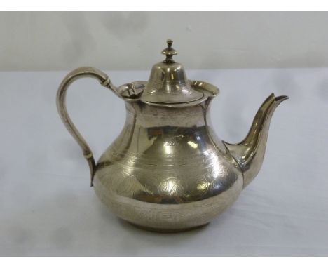 A Victorian silver teapot, compressed pear shape with domed handle and hinged cover, London 1865 by Joseph Angel