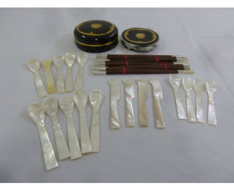 A quantity of Mother of Pearl caviar eaters, a set of lacquered black and gold coasters and five pairs of chopsticks