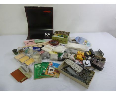 A quantity of modelling accessories, tools and a Marklin Z gauge calendar for 1988