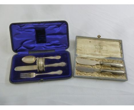 A cased Christening set comprising a silver knife, fork and spoon with matching napkin ring and a cased set of Continental wh