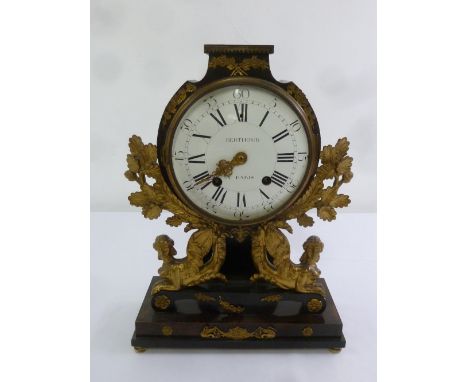 Berthold Paris mantle clock, enamel dial with Roman and Arabic numerals, supported by classical harpies, oak leaves on rectan