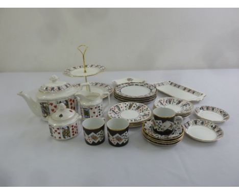 A quantity of ceramics by Queens and Tiffany with playing card design to include cups, saucers a teapot and plate stand
