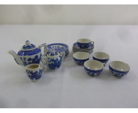 A miniature blue and white teaset to include teapot, milk jug, sugar bowl, cups, saucers and plates (20)