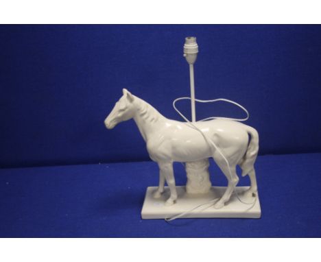 A TABLE LAMP IN THE FORM OF A HORSE