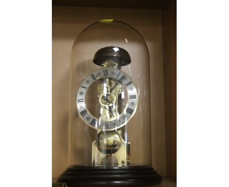 A DOME CASED MANTLE CLOCK