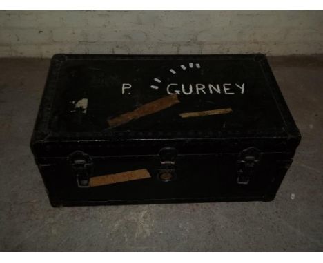 A BLACK WOODEN TRAVEL TRUNK