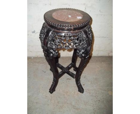AN EBONISED MARBLE TOPPED PLANTER