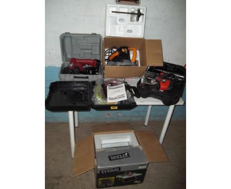 A SELECTION OF BOXED POWER HAND TOOLS TO INCLUDE CORDLESS SAW, A TILE CUTTER, AN AGRICULTURE SAW, A BLACK AND DECKER ROUTER E