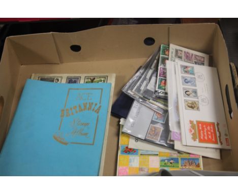 A TRAY OF FIRST DAY COVERS AND A SMALL QUANTITY OF STAMPS