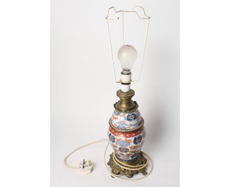 An Imari vase fitted as a table lamp with gilt metal base