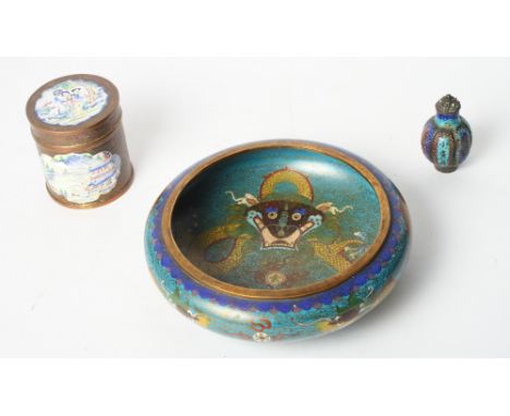 A Chinese cloisonné enamel bowl with dragon decoration, a Chinese copper cylindrical box and cover with enamelled panels and 