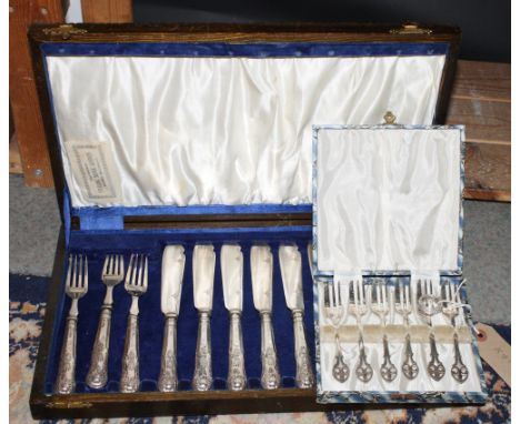 A canteen of six pairs of King's Pattern fish knives and forks, a cased set of cake forks and a silver ring set brilliants