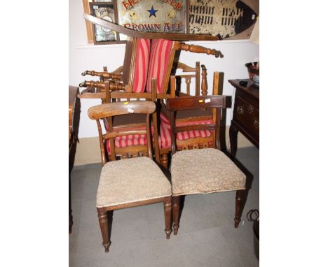 A set of six Arts & Crafts oak dining chairs, three pierced splats to back, stuffed over seats upholstered in a red striped f