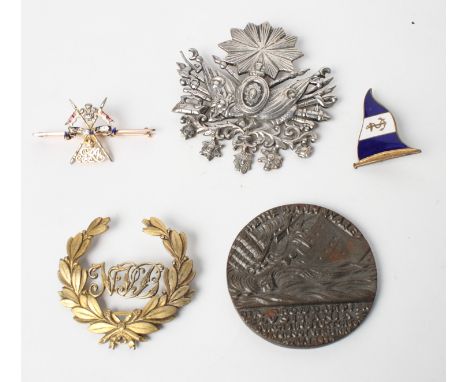 A gold and enamel sweetheart brooch, an enamel Naval brooch, a cap badge, a white metal military brooch and a Lusitania medal