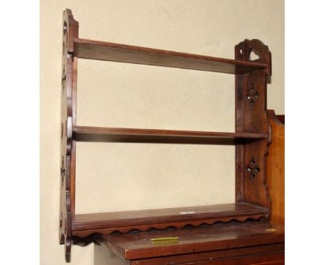 A Victorian open wall shelf, fitted three shelves with pierced sides, 22" wide