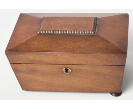A 19th Century mahogany sarcophagus-shaped tea caddy, 8" wide