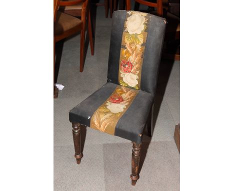 A Victorian nursing chair, the back and seat upholstered in black with central floral tapestry panel (for reupholstery)An oak